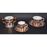 A Royal Crown Derby 1128 Imari tea cup and saucer; a demitasse cup and saucer;