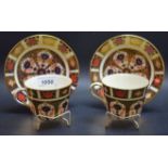 A pair of Royal Crown Derby 1128 Imari cups and saucers,