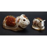 A Royal Crown Derby paperweight, Guinea Pig, gold stopper, boxed; another, Piglet, gold stopper,