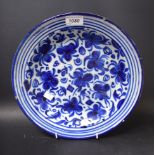 An 18th century South European blue and white tin glazed circular charger