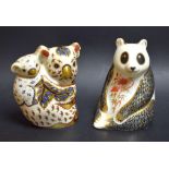 A Royal Crown Derby paperweight Panda, gold stopper; another; Koala and baby,