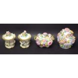 A pair of late 19th century Coalport inwells and covers, encrusted with flowers,