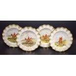 A set of four Royal Crown Derby hunting scene fluted dinner plates,