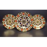 A Royal Crown Derby 1128 Imari 27cm plate; a pair of 21cm plates similar;