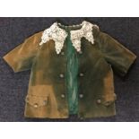 A 19th century child's green velvet frock coat, lace collar,