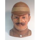 A Bernard Bloch pottery tobacco jar and cover, as a British officer of the Boer War, bust-length,