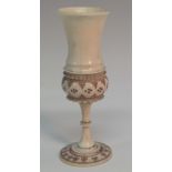 A 19th century Anglo-Indian ivory miniature goblet, waisted bowl, decorated with lotus and roundels,