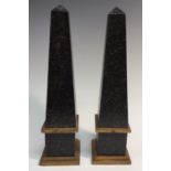 A pair of parcel-gilt and painted softwood obelisks,