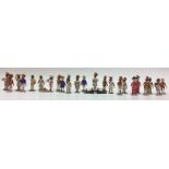 A collection of Indian painted softwood figures, each with paper label, Village Woman with Toddy,