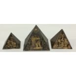A graduated set of three Egyptian Grand Tour 'toleware' models of a pyramids,