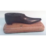 A 19th century Welsh slate novelty inkwell, as a shoe, the insole carved with three apertures,