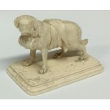 A late 19th century Continental ivory carving, of a St Bernard dog, he stands, carrying a barrel,