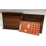 A 19th century mahogany coin cabinet, fielded panelled door, the interior with twenty-one slides,