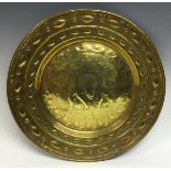 A Dutch brass circular alms dish,