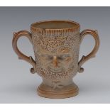 A 19th century brown salt glazed stoneware Bacchus mask two-handled mug, relief moulded,