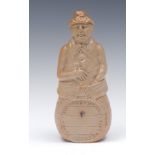 A 19th century brown salt glazed stoneware figural flask, of a man seated on a barrel,