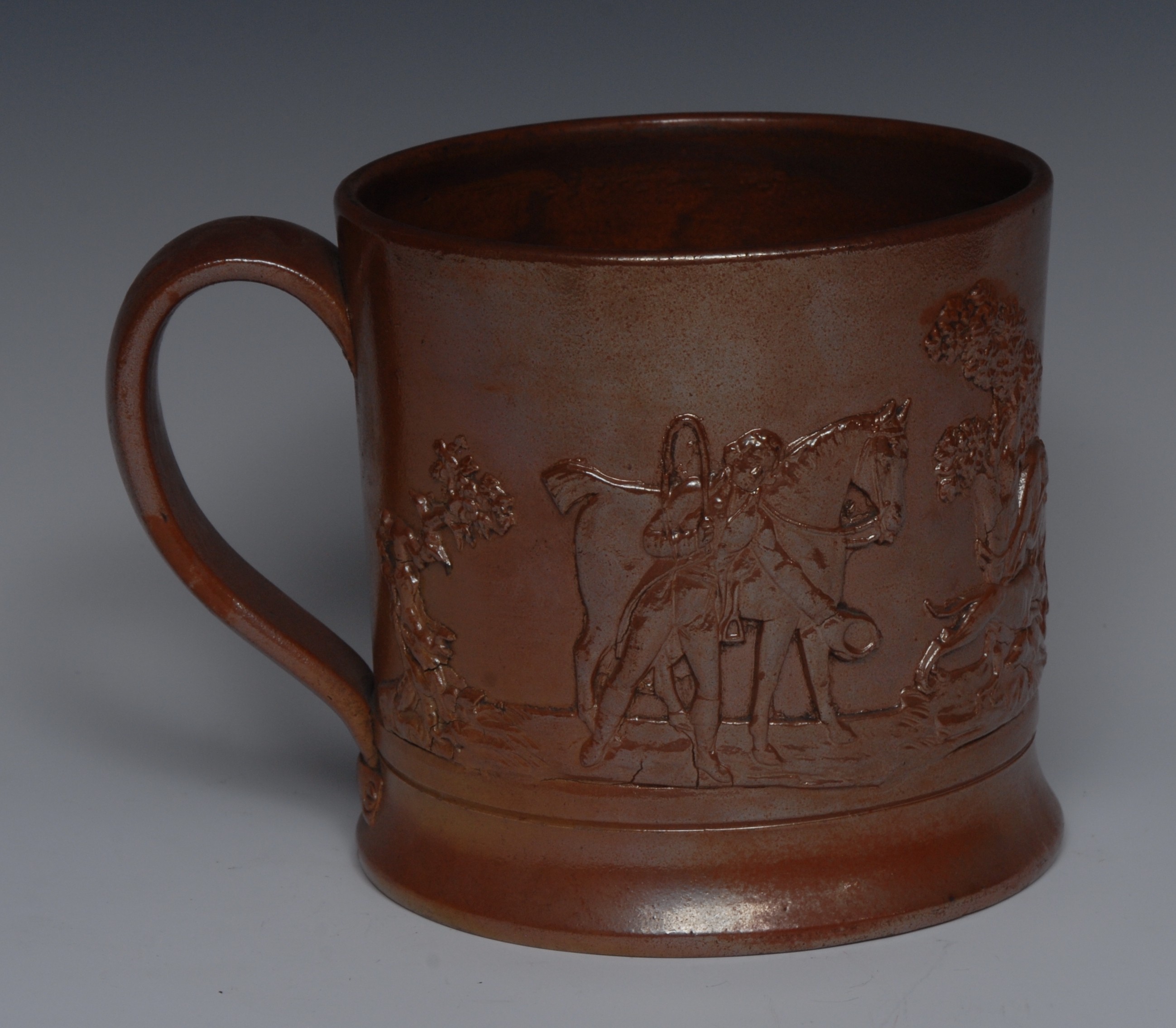 A 19th century Derbyshire brown salt glazed stoneware mug,