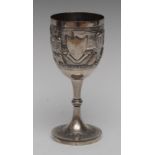 An Indian silver pedestal goblet, hemi-ovoid bowl chased with village, figures and elephants,