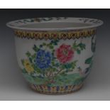 A Cantonese ovoid jardiniere, enamelled in the famille rose palette with peacocks,