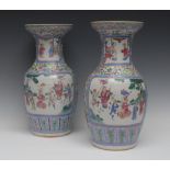 A pair of early 19th century Chinese Cantonese vases, decorated with panels, of noble men,