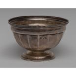 Asprey & Co - a George V silver panelled circular pedestal bowl, gadrooned rim,