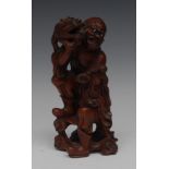 A Chinese boxwood figure, well carved as an elder with a dragon, 21cm high,