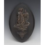 A 19th century French holy water stoup, applied with a silvered plaque depicting a kneeling saint,