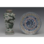 A Chinese baluster vase, decorated in green with scrolling dragon, outlined in black, 17cm high,