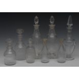 A pair of Victorian slender baluster spirit decanters, pointed prismatic stoppers,