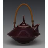 A Chinese sang de boeuf monochrome kettle, of angular form, the cover with spire finial,