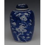 A Chinese ginger jar and cover, decorated with blossoming prunus branches, 21cm high,