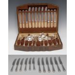 An Edwardian Old English and Shell pattern part canteen, comprising four table spoons, two ladles,