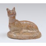 A Brampton brown salt glazed stoneware model of a recumbent fox,