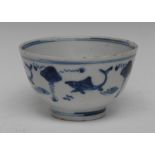 A Chinese blue and white bowl, painted with stylised fish, tramline borders,