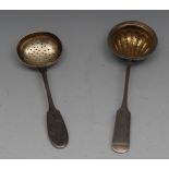 A Russian silver Fiddle pattern sifter spoon, circular bowl chased as a shell and gilt, 17.