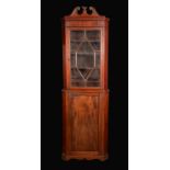 A 19th century mahogany floor standing corner cupboard,