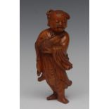 A Chinese boxwood figure, carved as a young boy holding a basket, 16cm high,