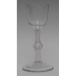 A George III opaque twist drinking glass, ovoid bowl, knopped stem, spreading circular foot, 13.