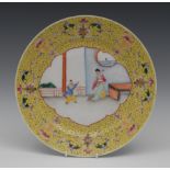 A Chinese circular plate, the field painted with oriental figures,