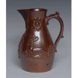 A mid 19th century Brampton brown salt glazed stoneware jug, in relief with recumbent stag,