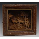 A 19th century folk art cork diorama, carved as a huntsman, deer and hound, he stands,