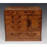 An early 20th century walnut table-top collector's cabinet, of Chinese design,