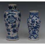 A Chinese slender baluster vase, decorated in underglaze blue with stylised bird, peony and foliage,