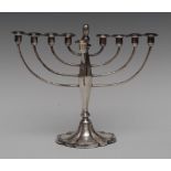 Judaica - a George VI silver menorah, outswept branches, panelled baluster column,