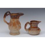 A mid 19th century brown salt glazed stoneware jug, in relief with hanging dead game,