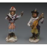A pair of Staffordshire porcelain Monkey Band Orchestra members, after the models by J.J.