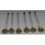 A set of six Russian silver spoons, stylised flower finials, twisted stems, gilt bowls,