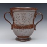 An 18th century Nottingham brown salt glazed stoneware two-handled loving cup, of thistle form,