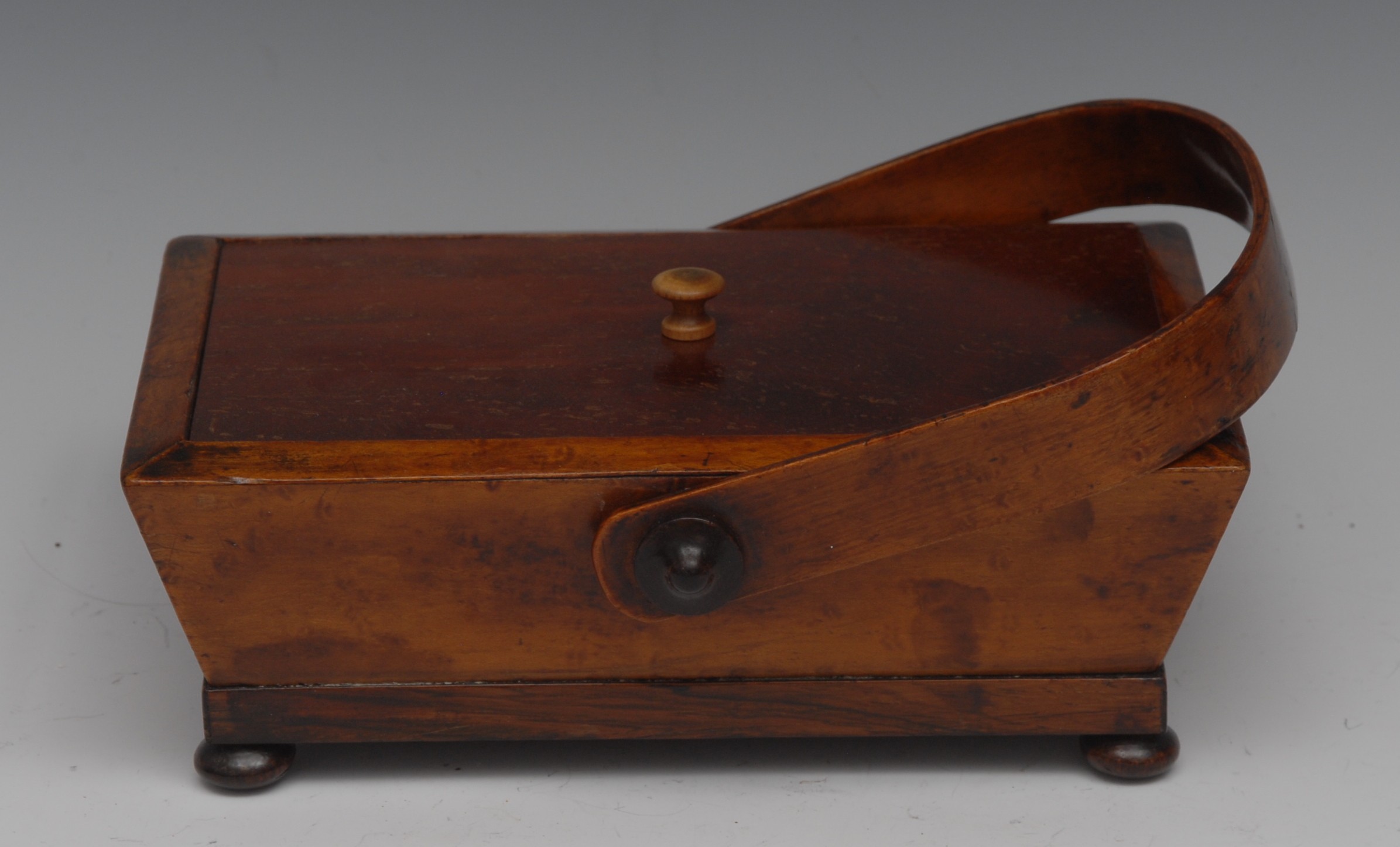 A Regency maple, rosewood and mahogany rectangular basket shaped work box, swing handle, bun feet,