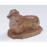 A Brampton brown salt glazed stoneware model of a recumbent sheep, shaped oval base, 7.